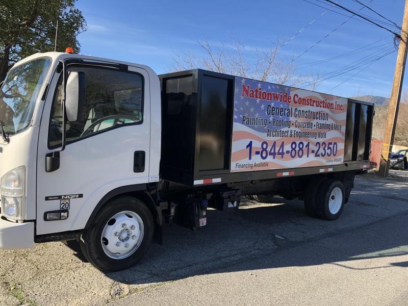 Nationwide Construction Inc company truck with logo, parked at a jobsite